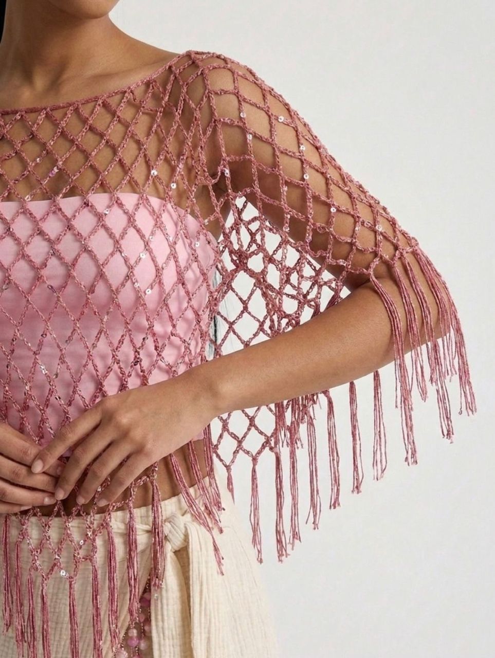 SADIN blush macramé poncho with hand-knotted netting, sequins and fringe